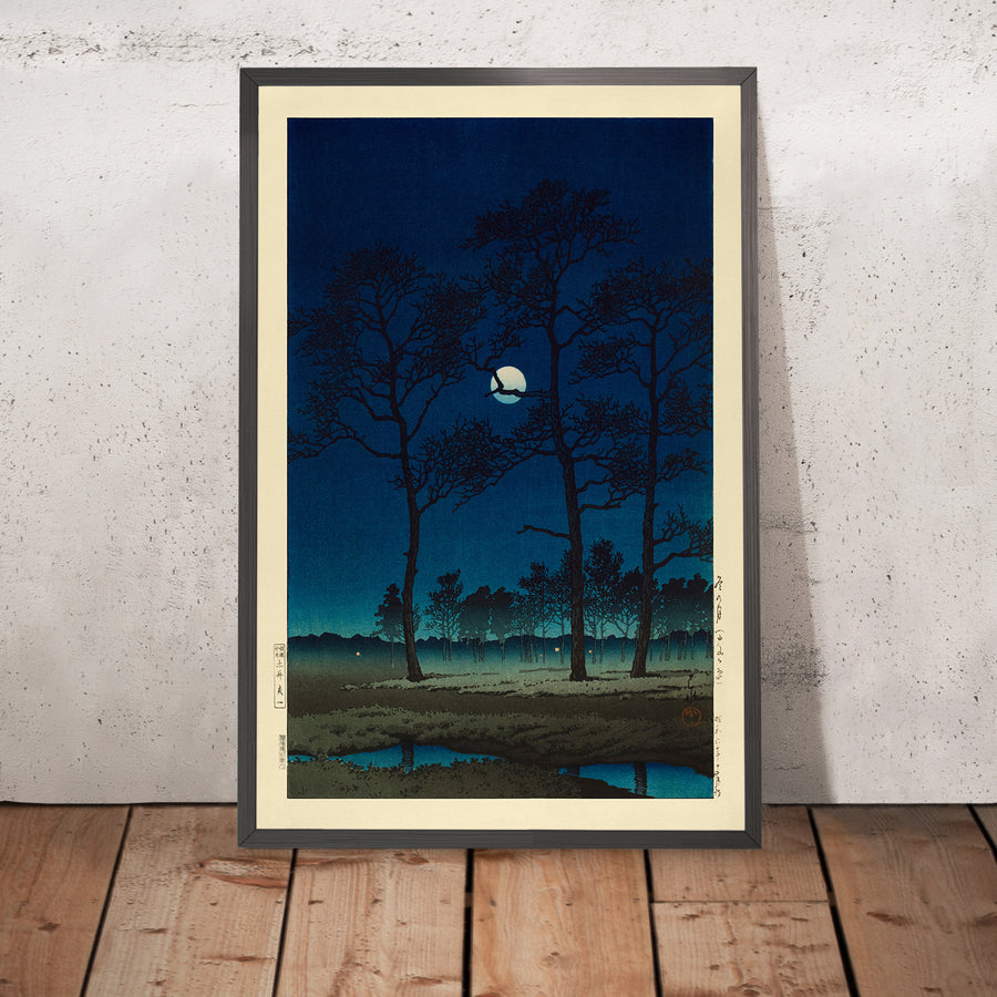 A framed image of Winter Moon over Toyama Plain by Hasui Kawase, 1931