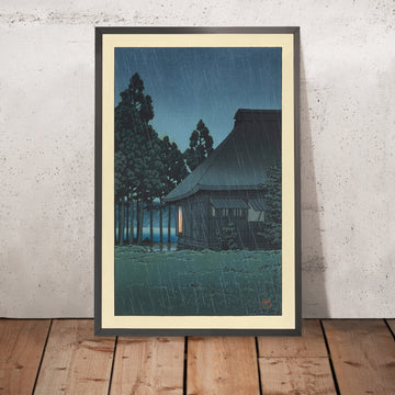 A framed image of Evening Rain at a Lakeside Tearoom by Hasui Kawase 1935