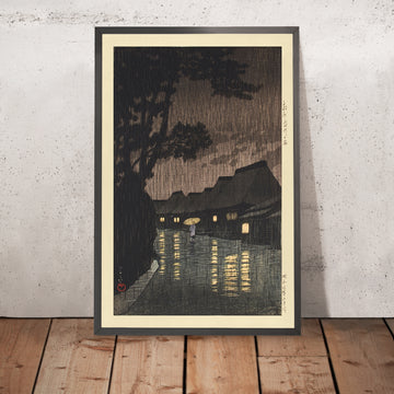Una imagen enmarcada de Lluvia en Maekawa, provincia de Sagami, de Hasui Kawase, 1935