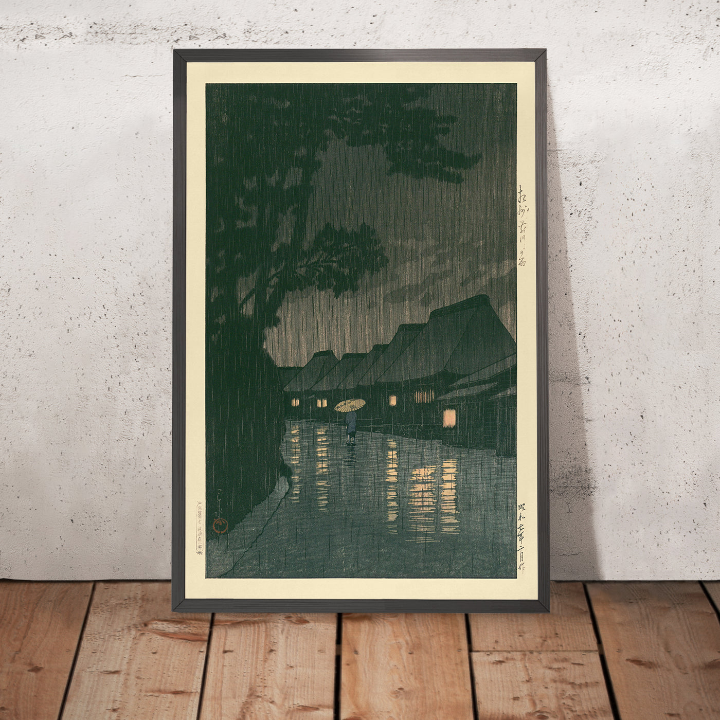 A framed image of Rainy Night in Maekawa by Hasui Kawase, 1935